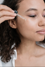women applying serum skin care clean beauty