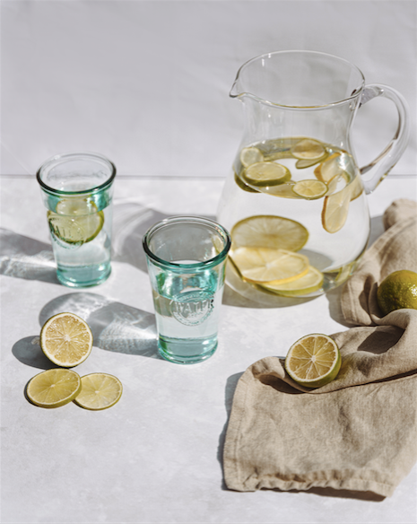 wellness water with lemons and two glasses